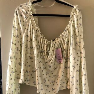 Off the shoulder  crop with puffy sleeves.